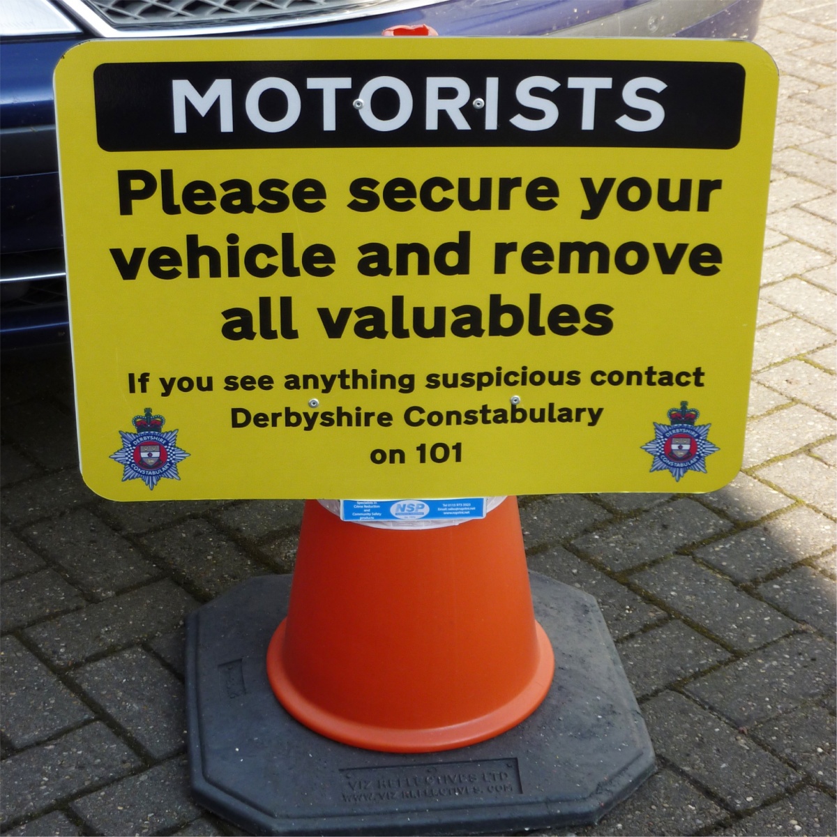 temporary cone sign advising vehicle users to take valuables with them