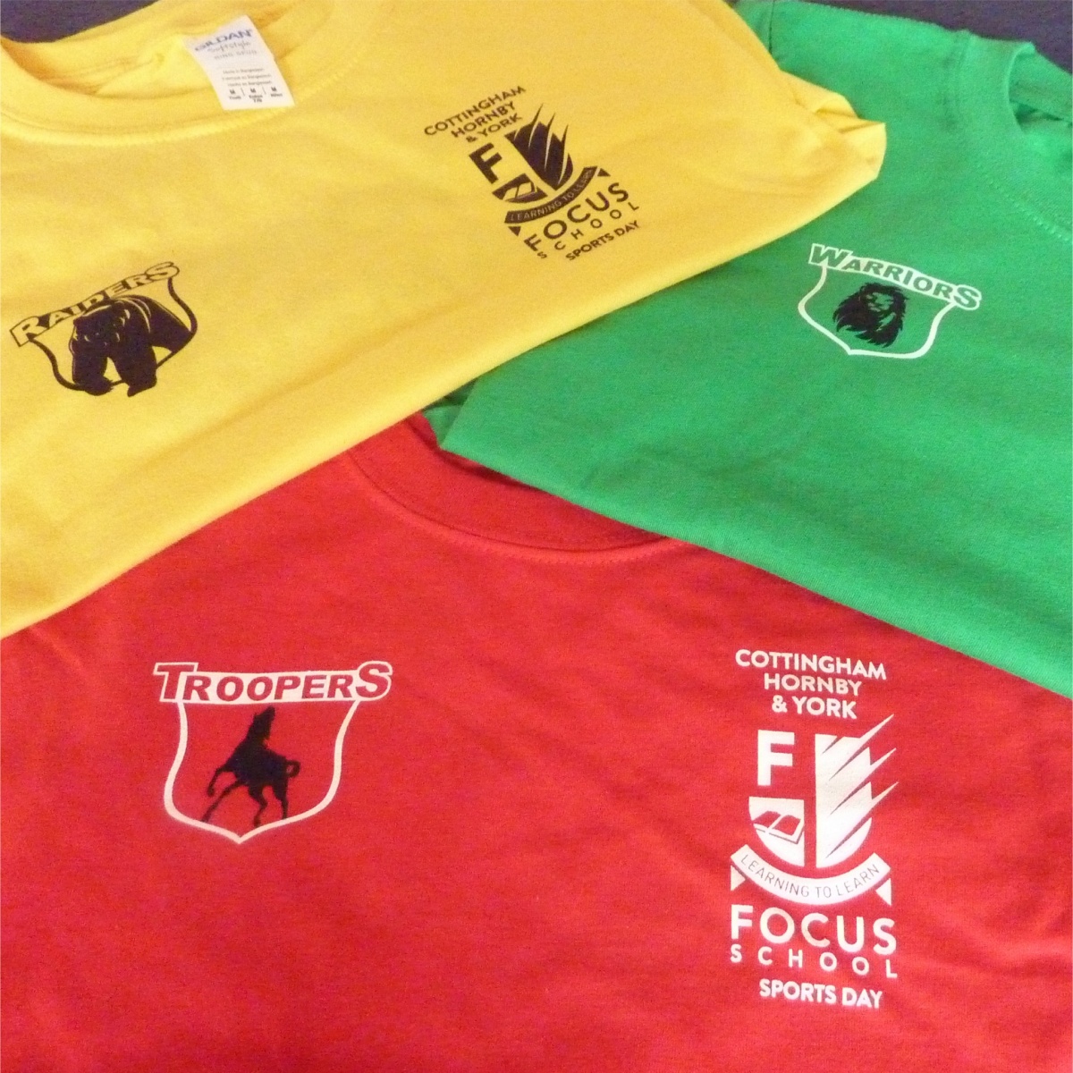 bright coloured t shirts finished with printed logos