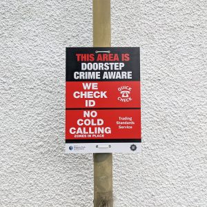 crime prevention sign mounted to lamppost